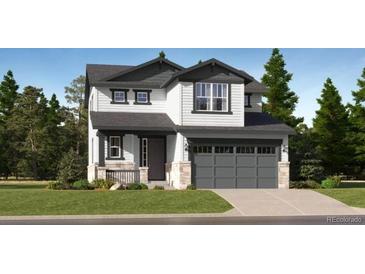 Charming two-story home with gray garage door and a beautifully landscaped front yard at 7759 S Cherokee Trl, Centennial, CO 80016