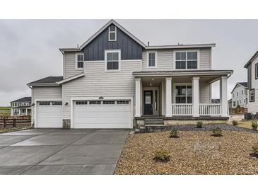 Charming two-story home with a three-car garage and inviting front porch at 39857 Floyd St, Elizabeth, CO 80107