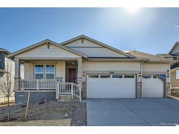 Charming single-Gathering home featuring a two-car garage and welcoming front porch at 615 Twilight St, Erie, CO 80516