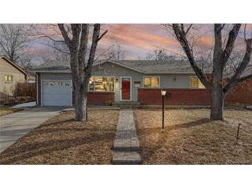 Charming single-story home with brick accents and a well-maintained front yard at 3246 S Stuart St, Denver, CO 80236