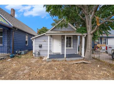 Charming single-story home with a quaint front porch and a mature tree providing shade at 4533 N Pennsylvania St, Denver, CO 80216