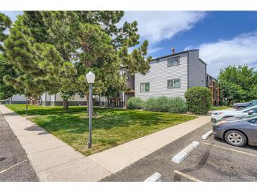 Well maintained apartment building exterior featuring mature trees and landscaping at 16259 W 10Th Ave # K1, Golden, CO 80401