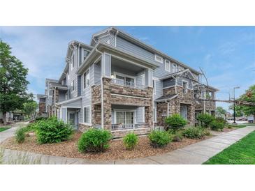 Beautiful townhome with stone accents and private balconies offers a charming and inviting exterior at 5255 Memphis St # 1009, Denver, CO 80239
