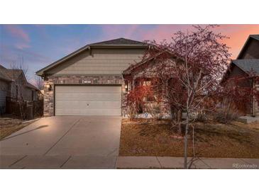 Charming single-Gathering home featuring a two-car garage and welcoming exterior at 157 Sand Cherry St, Brighton, CO 80601