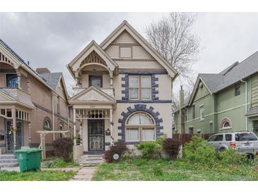 Charming two-story home with unique architectural details and a welcoming front porch at 2245 Julian St, Denver, CO 80211