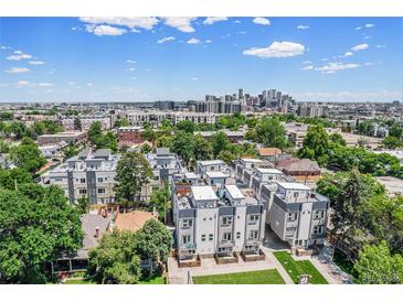 A captivating aerial view of the townhomes showcases its modern design and urban setting at 2726 Federal Blvd # 1, Denver, CO 80211