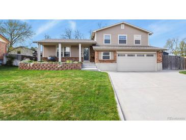 Charming two-story home with a well-maintained front yard and an attached two-car garage at 4510 E 121St Pl, Thornton, CO 80241