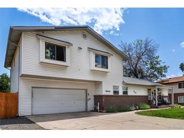 Charming two-story home with a spacious two-car garage and a well-maintained lawn at 9040 Raleigh St, Westminster, CO 80031