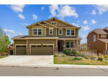 Charming two-story home with a three-car garage and a welcoming front porch at 13440 Monaco St, Thornton, CO 80602