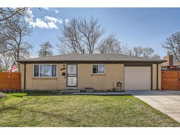 Charming single-story brick home with a well-manicured lawn and an attached one car garage at 6033 Hoyt Ct, Arvada, CO 80004