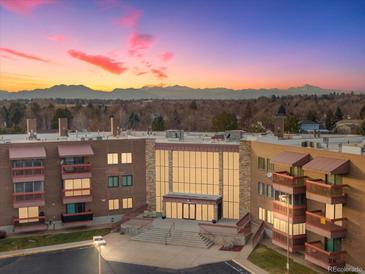 Attractive building exterior with mountain views at 12565 Sheridan Blvd # 208, Broomfield, CO 80020