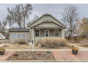 Charming home featuring a covered front porch and xeriscaped front yard at 109 W Simpson St, Lafayette, CO 80026