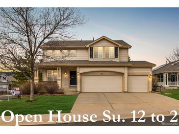 Charming two-story home featuring a three-car garage and covered porch at 7661 Chickaree Ct, Littleton, CO 80125