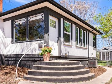 Charming home featuring a welcoming entrance with bright white trim and a black accent base at 2517 W 44Th Ave, Denver, CO 80211
