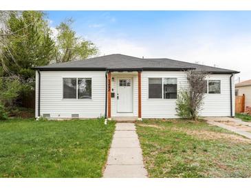 Charming single-story home with a well-manicured lawn and inviting curb appeal at 1213 Jamaica St, Aurora, CO 80010