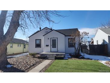 Charming white single-story home with a well-maintained front yard and inviting entrance at 1409 S Clermont St, Denver, CO 80222