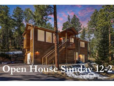 Charming two-story wood home with an open house on Sunday from 12-2 at 6752 S Columbine Rd, Evergreen, CO 80439