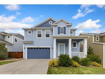Charming two-story home with a covered front porch and a well-manicured lawn, perfect for a Gathering at 713 San Juan Dr, Lafayette, CO 80026