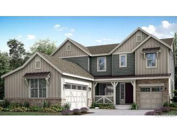 Charming two-story home boasts a stylish design with a two-car garage and inviting curb appeal at 14701 Hudson St, Thornton, CO 80602