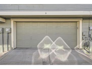 Attached one-car garage providing secure parking and additional storage space at 1920 S Hannibal St # B, Aurora, CO 80013
