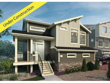Modern two-story home with attached garage and deck at 16130 E 111Th Dr, Commerce City, CO 80022