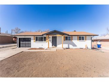 Charming single-story home with a freshly painted exterior and an attached garage at 8271 Bluebell Way, Denver, CO 80221