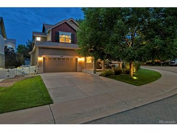 Charming two-story home with a well-manicured lawn, covered porch, and two car garage at 3540 Brushwood Dr, Castle Rock, CO 80109