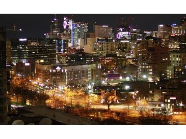 Stunning night view of the city skyline with illuminated buildings and streetlights below at 130 N Pearl St # 1804, Denver, CO 80203