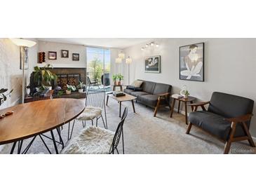Inviting living room with fireplace and access to private balcony at 805 29Th St # 308, Boulder, CO 80303