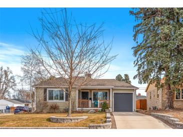 Charming ranch home with landscaped yard and attached garage at 2602 S Lafayette St, Denver, CO 80210