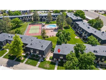 An aerial view of the apartment complex with amenities, including a pool and tennis court at 6856 S Broadway, Centennial, CO 80122