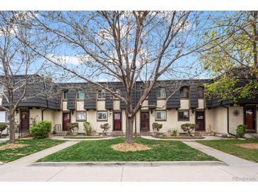 Charming townhomes showcasing individual entrances and nicely manicured lawns at 6930 S Broadway, Centennial, CO 80122