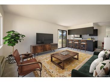 Comfortable living room that opens to kitchen, with carpet, stylish furniture, and sliding doors to a patio at 645 Manhattan Pl # 106, Boulder, CO 80303