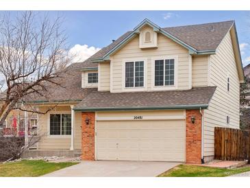 Charming two-story home with attached two car garage and brick accents at 20481 E Mansfield Pl, Aurora, CO 80013