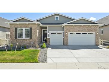 Charming single-story home with a well-manicured lawn and a convenient three-car garage, located in a desirable neighborhood at 6980 S Yantley Ct, Aurora, CO 80016