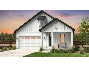 White farmhouse-style home with a two-car garage and welcoming front porch at 39732 Penn Rd, Elizabeth, CO 80107