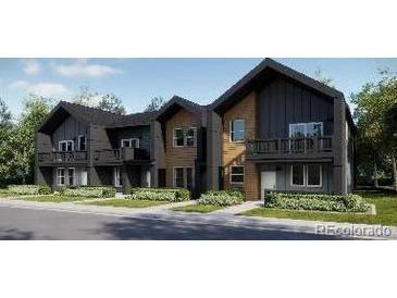 Modern townhome exteriors featuring a two-story design with beautiful architectural details at 8957 Whiteclover St, Littleton, CO 80125