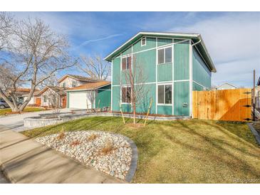 Charming two-story house with landscaped yard and wood fence at 6643 W 96Th Ave, Broomfield, CO 80021