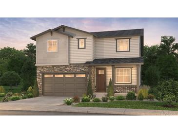 Beautiful two-story home with stone accents, a covered front porch, and a two-car garage at 2187 S Jackson Gap St, Aurora, CO 80018