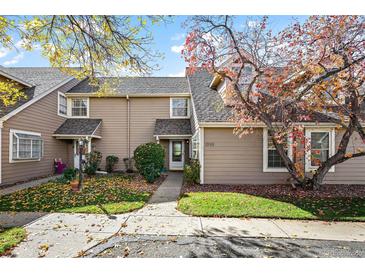 Charming townhome with mature landscaping and a welcoming entryway at 1995 S Xanadu Way, Aurora, CO 80014