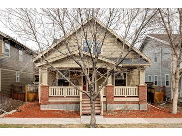 Charming home featuring a front porch with brick accents and a well-maintained landscaped yard at 4363 W 118Th Way, Westminster, CO 80031