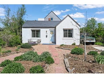 Charming single story home with a landscaped front yard and stone walkway at 1354 Tamarac St, Denver, CO 80220