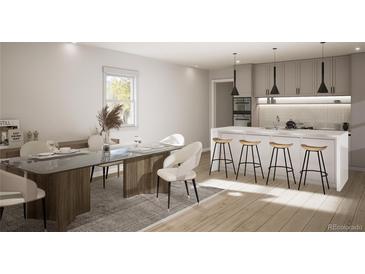 Bright dining space features a table with seating for six, modern light fixtures, and a hardwood floor at 314 Galapago St, Denver, CO 80223