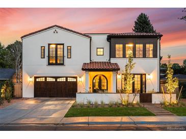 Stunning two-story home showcasing a blend of modern design and classic charm with professional landscaping at 200 Magnolia St, Denver, CO 80220