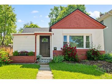 Charming home featuring a well-kept lawn and mature landscaping at 3024 S Sherman St, Englewood, CO 80113