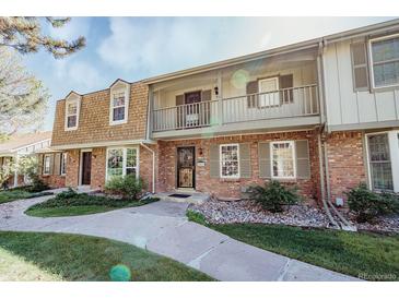 Charming brick townhouse with a balcony, well-maintained front yard and ample curb appeal at 2523 E Geddes Ave, Centennial, CO 80122