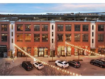 Charming brick building exterior with decorative lighting and street view at 7110 W Alaska Dr # A, Lakewood, CO 80226