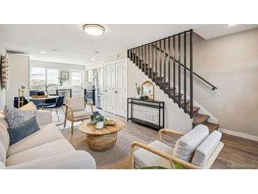 Living room showcasing a modern staircase and comfortable seating at 4336 Decatur St, Denver, CO 80211