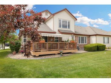 Expansive backyard featuring a spacious wooden deck perfect for entertaining and outdoor living at 16753 W 61St Ln, Golden, CO 80403