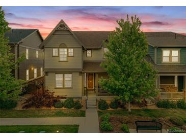 Charming two-story home featuring a covered porch, lush landscaping, and a welcoming facade at 540 E Fremont Pl, Centennial, CO 80122